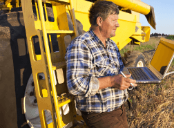 farmer on a laptop